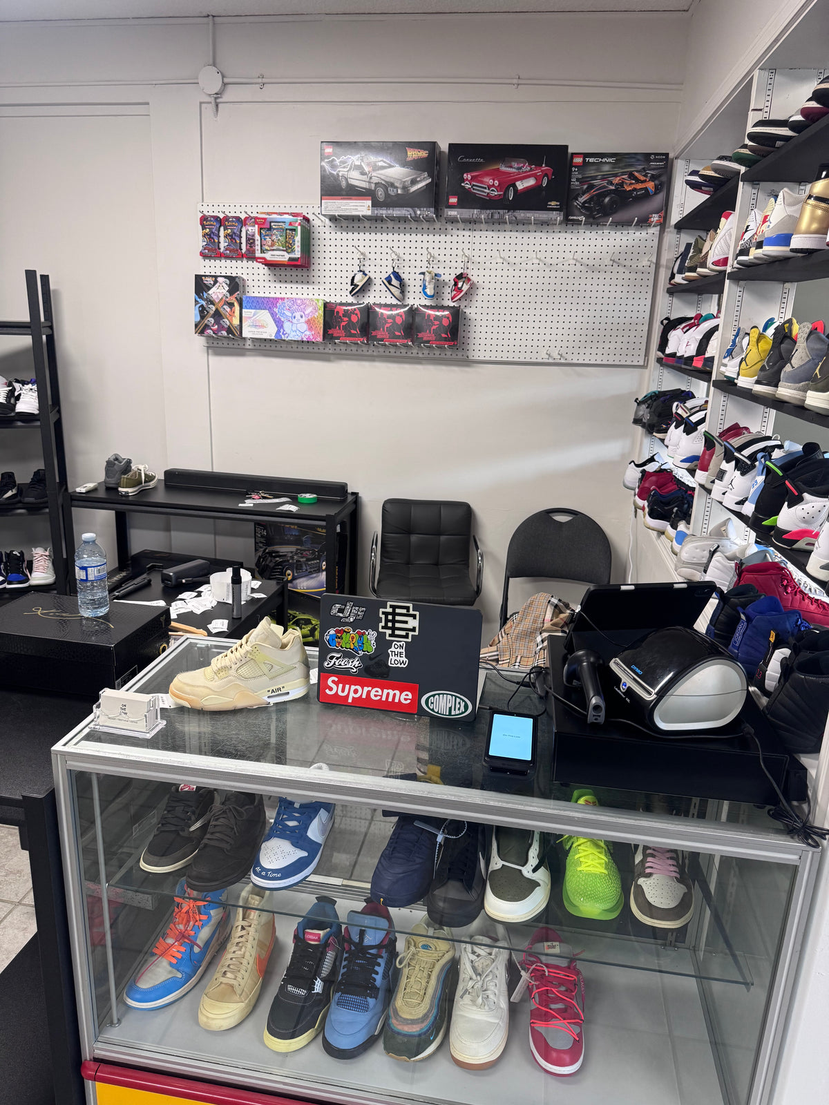 On The Low store counter with sneakers and collectibles